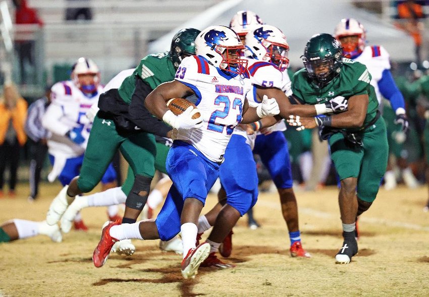 Neshoba Central’s Ken Drummond churns out yardage during the Rockets’ North State title bout at West Point last week.